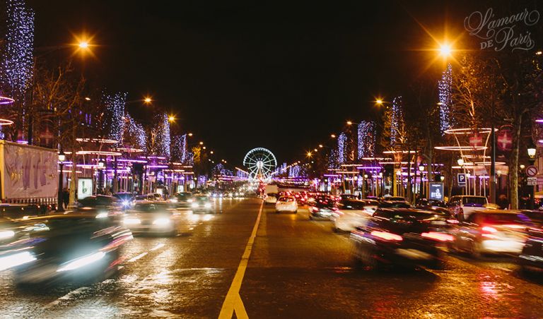 Photos of the nighttime views of the holiday lights on the Champs Elysees during Christmas in Paris