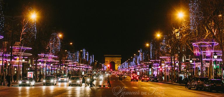 Photos of the nighttime views of the holiday lights on the Champs Elysees during Christmas in Paris
