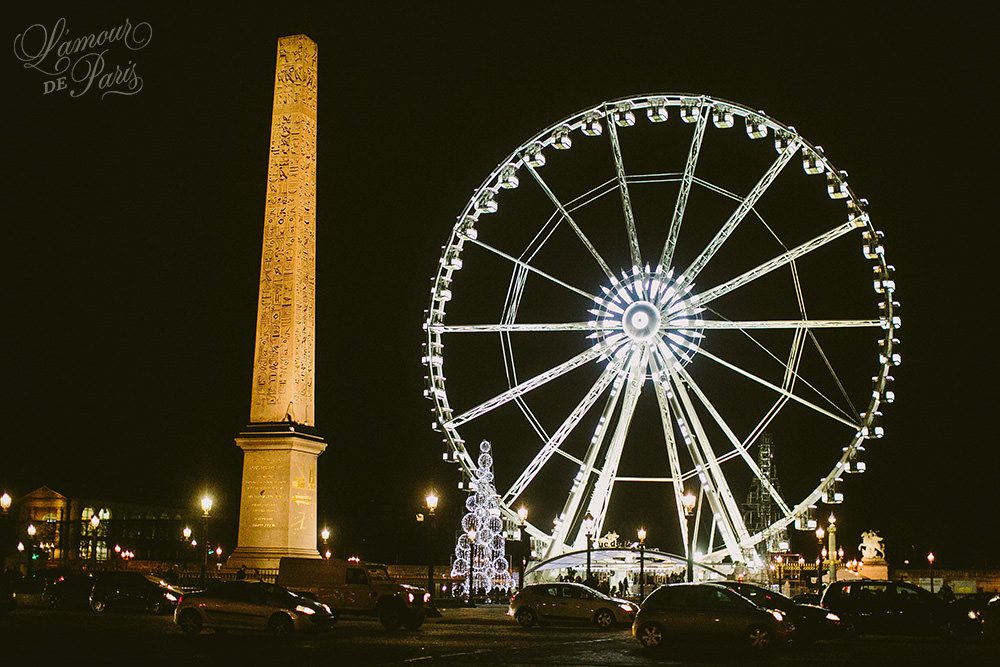 Landscape city views of Paris by night from the ferris wheel Roue de Paris