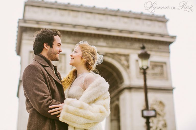Photographs of a couple eloping in Paris at the Arch de Triomphe on the Champs Elysees by Paris wedding photographer Stacy Reeves for portrait photo studio and vacation planning blog L'Amour de Paris.