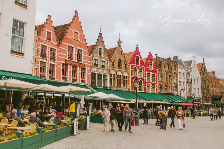 Street market and cafes in Brugge or Bruges, Belgium