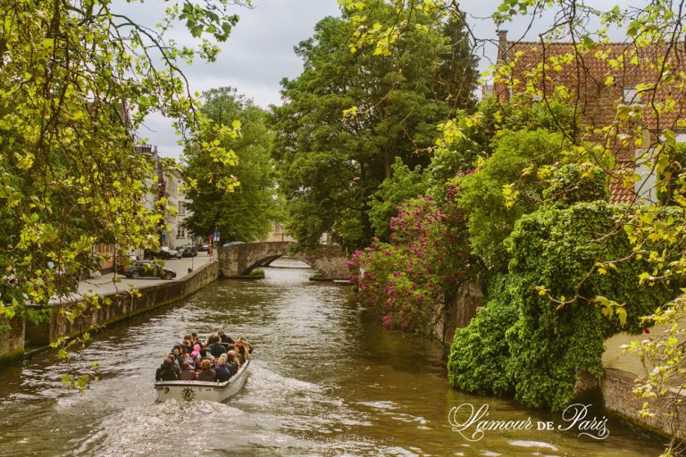 Tourist sightseeing boats on the canals in Brugge or Bruges, Belgium