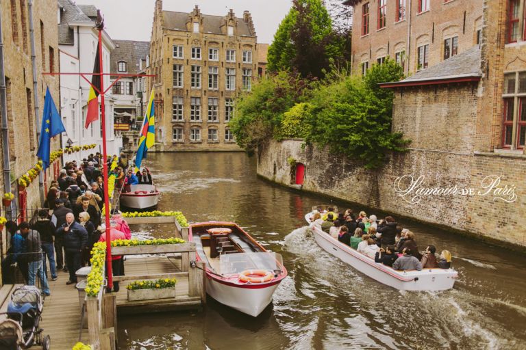 Tourist sightseeing boats on the canals in Brugge or Bruges, Belgium
