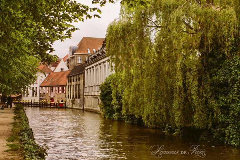 Tourist sightseeing boats on the canals in Brugge or Bruges, Belgium