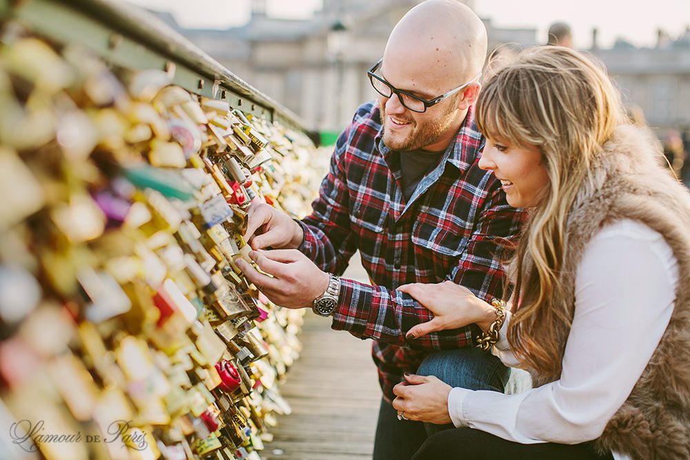 Romantic portraits at the Louvre, Pont des Arts Bridge, and Seine River in Paris by wedding photographer Stacy Reeves