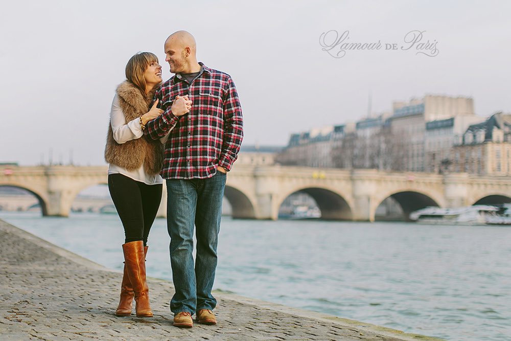 Romantic portraits at the Louvre, Pont des Arts Bridge, and Seine River in Paris by wedding photographer Stacy Reeves