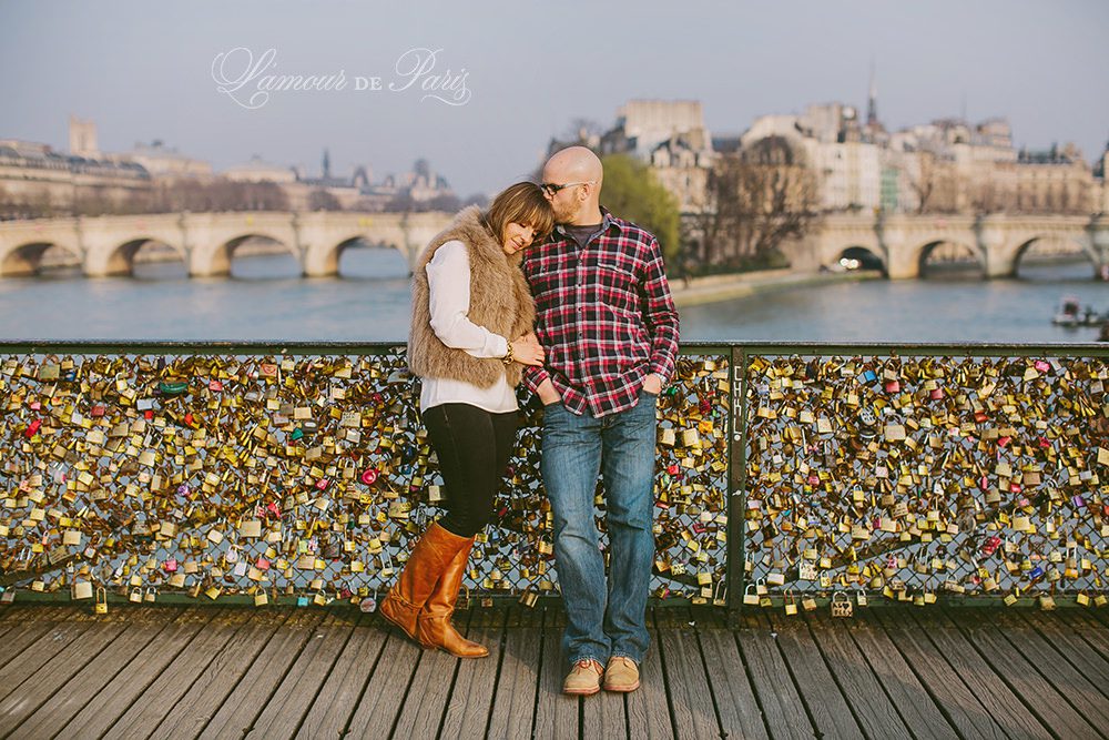 Romantic portraits at the Louvre, Pont des Arts Bridge, and Seine River in Paris by wedding photographer Stacy Reeves