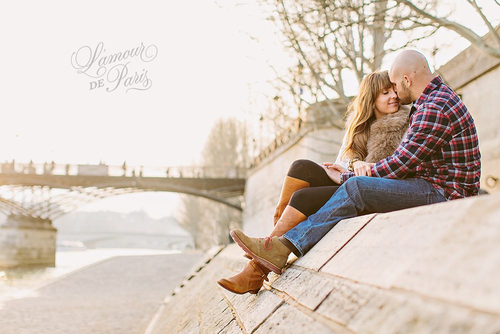 Romantic portraits at the Louvre, Pont des Arts Bridge, and Seine River in Paris by wedding photographer Stacy Reeves
