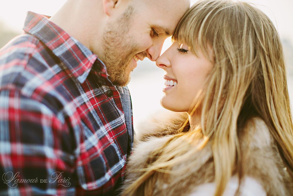 Romantic portraits at the Louvre, Pont des Arts Bridge, and Seine River in Paris by wedding photographer Stacy Reeves