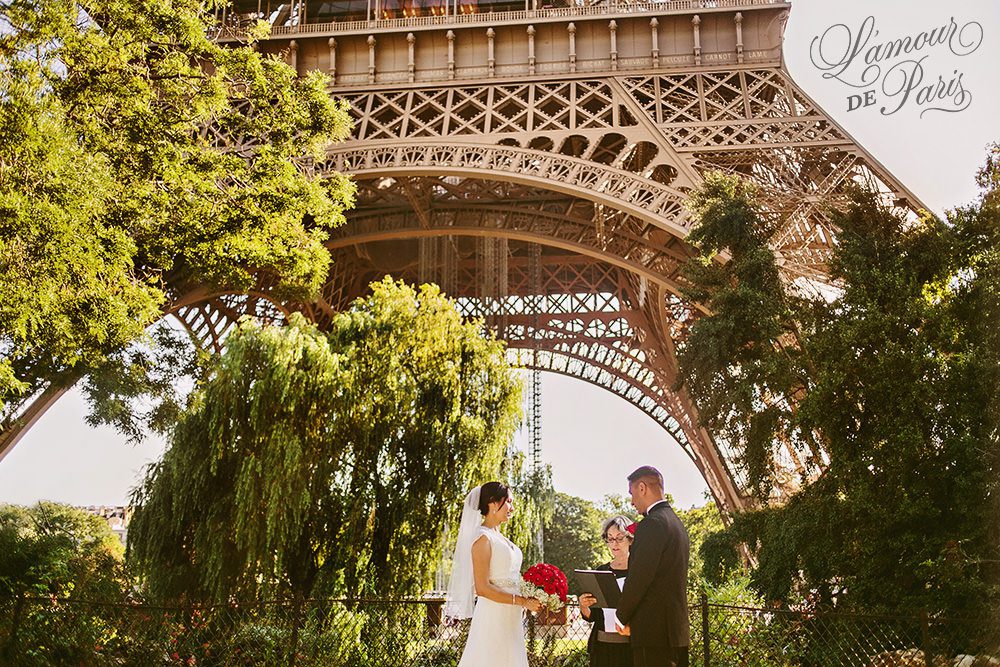 Paris elopement wedding ceremony in front of the Eiffel Tower by Paris wedding photographer Stacy Reeves