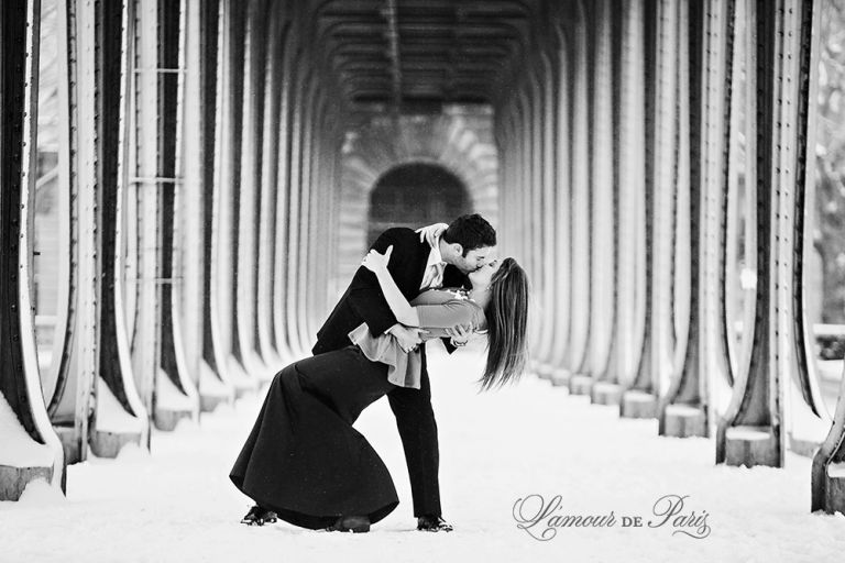 Couples portrait session at the Eiffel Tower in Paris during snow in winter