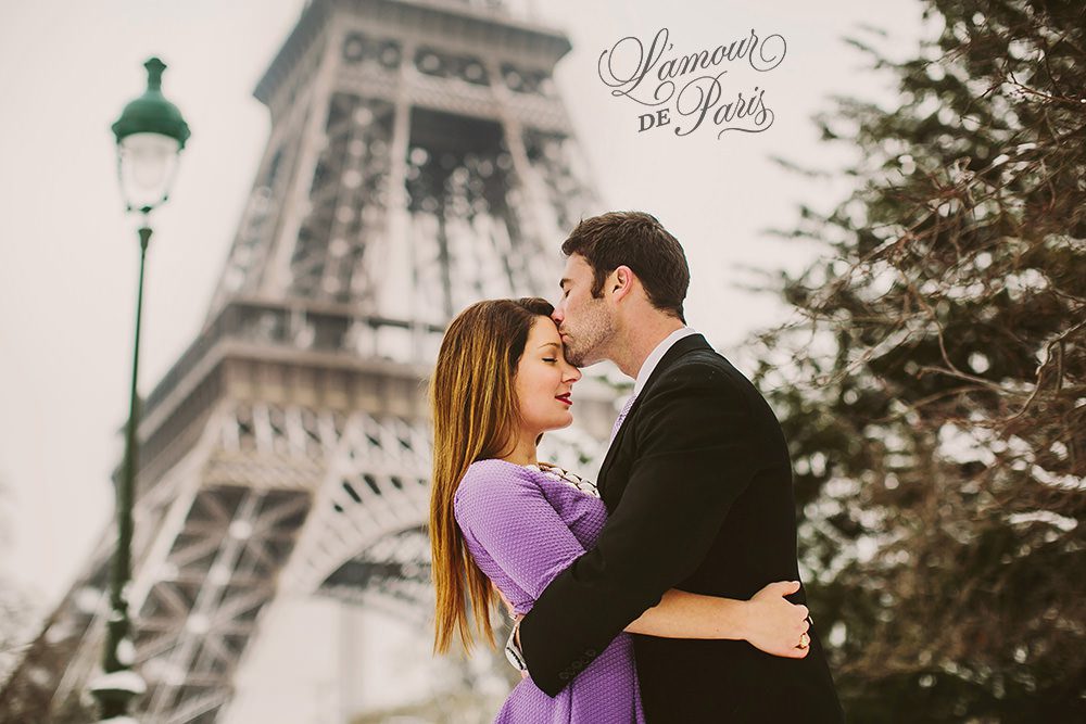 Couples portrait session at the Eiffel Tower in Paris during snow in winter