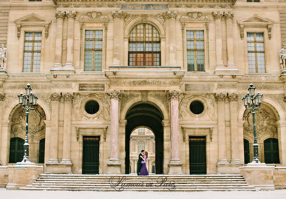 Couples portrait session at the Louvre in Paris during snow in winter