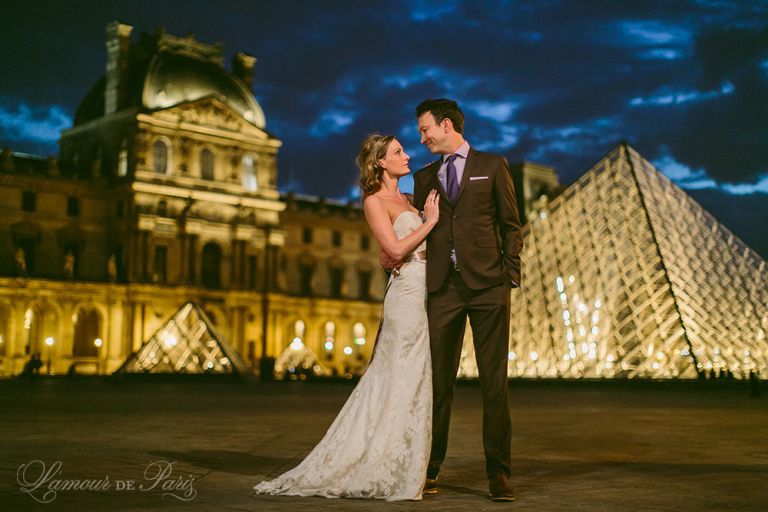 Paris elopement wedding ceremony at the Eiffel Tower, portrait photography at the Pont Alexandre III, Notre Dame de Paris, Pont des Arts love lock bridge, and a first dance and cake cutting at the Louvre at night. Photography by Stacy Reeves for destination wedding blog Lamour de Paris.