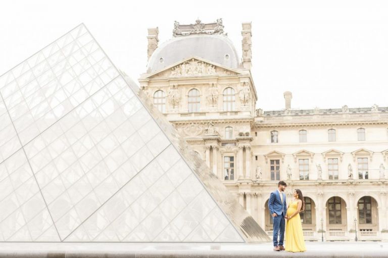 paris maternity photos at the louvre in yellow dress and blue suit