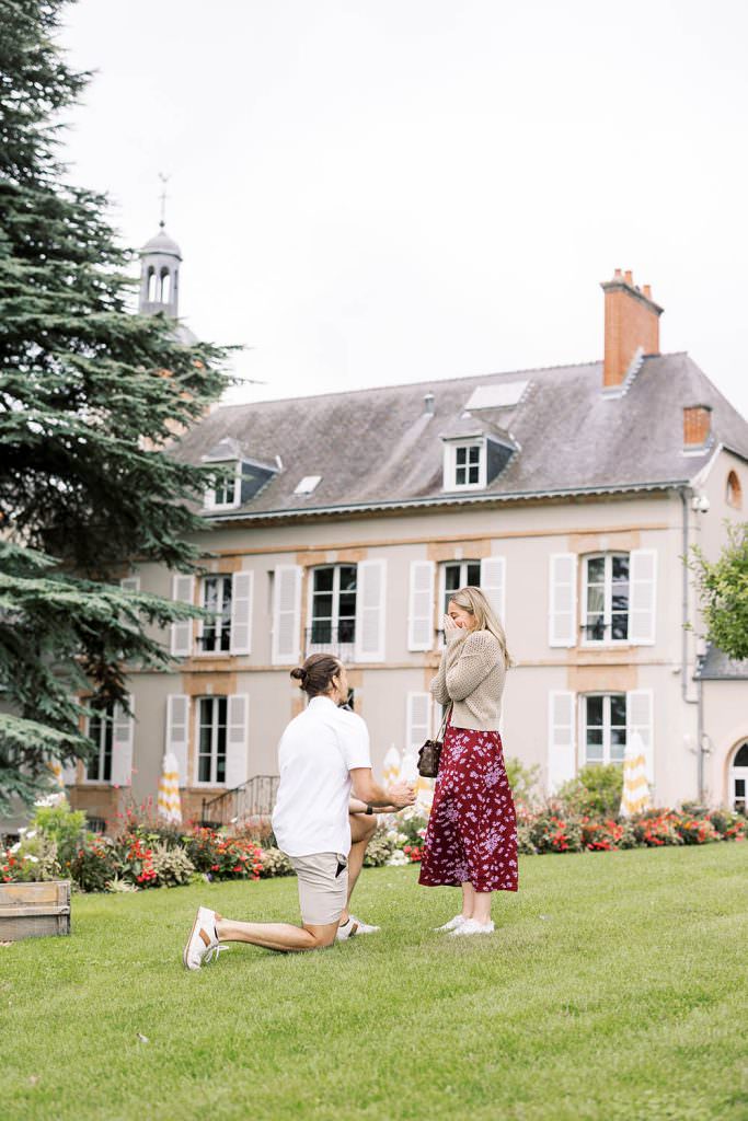 girl being surprised with a marriage proposal in Champagne