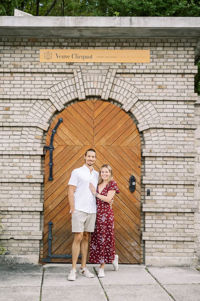 a couple at the champagne cellars of Veuve Clicquot