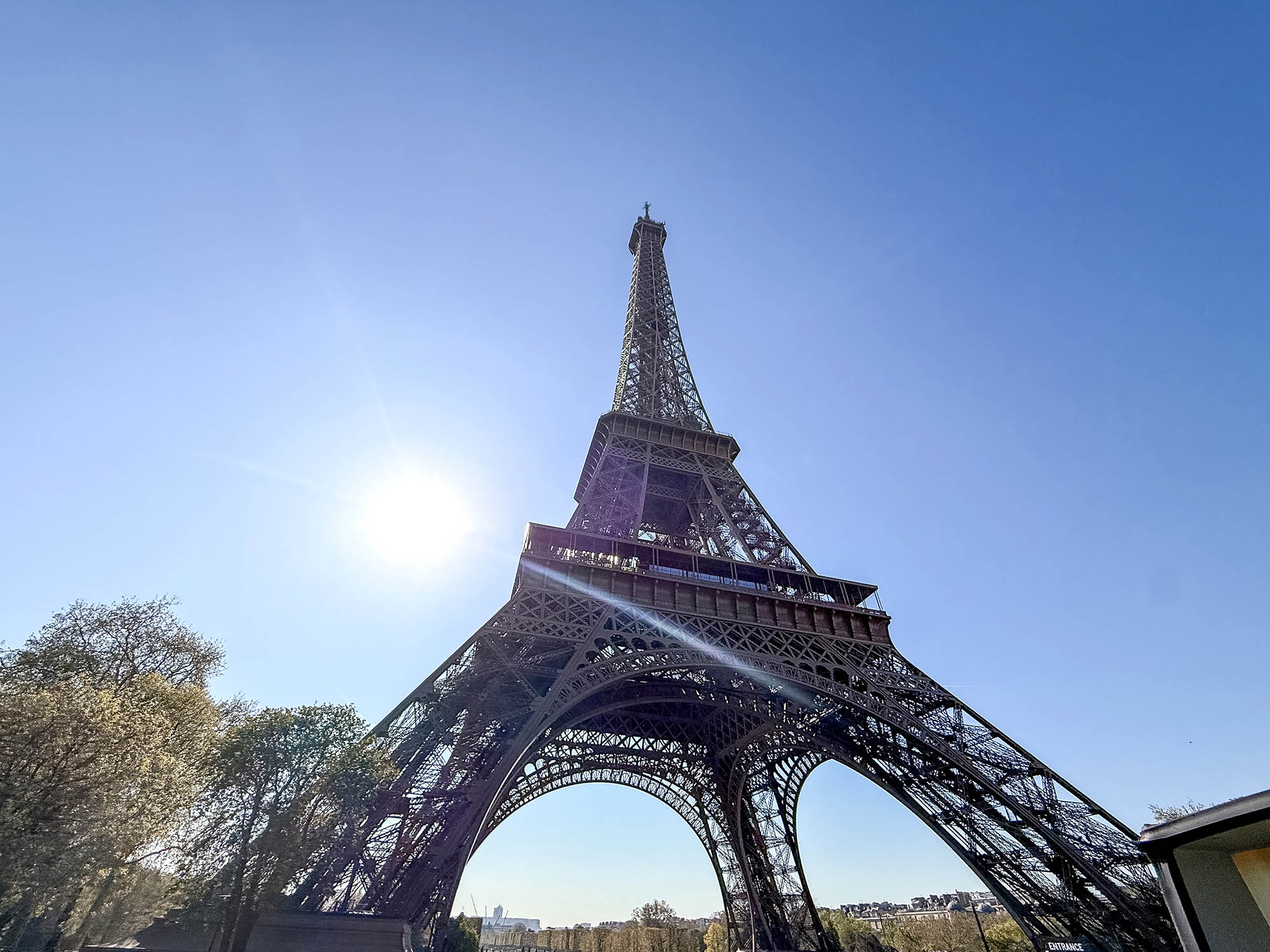 base of the eiffel tower seen from paris hop on hop off bus tour