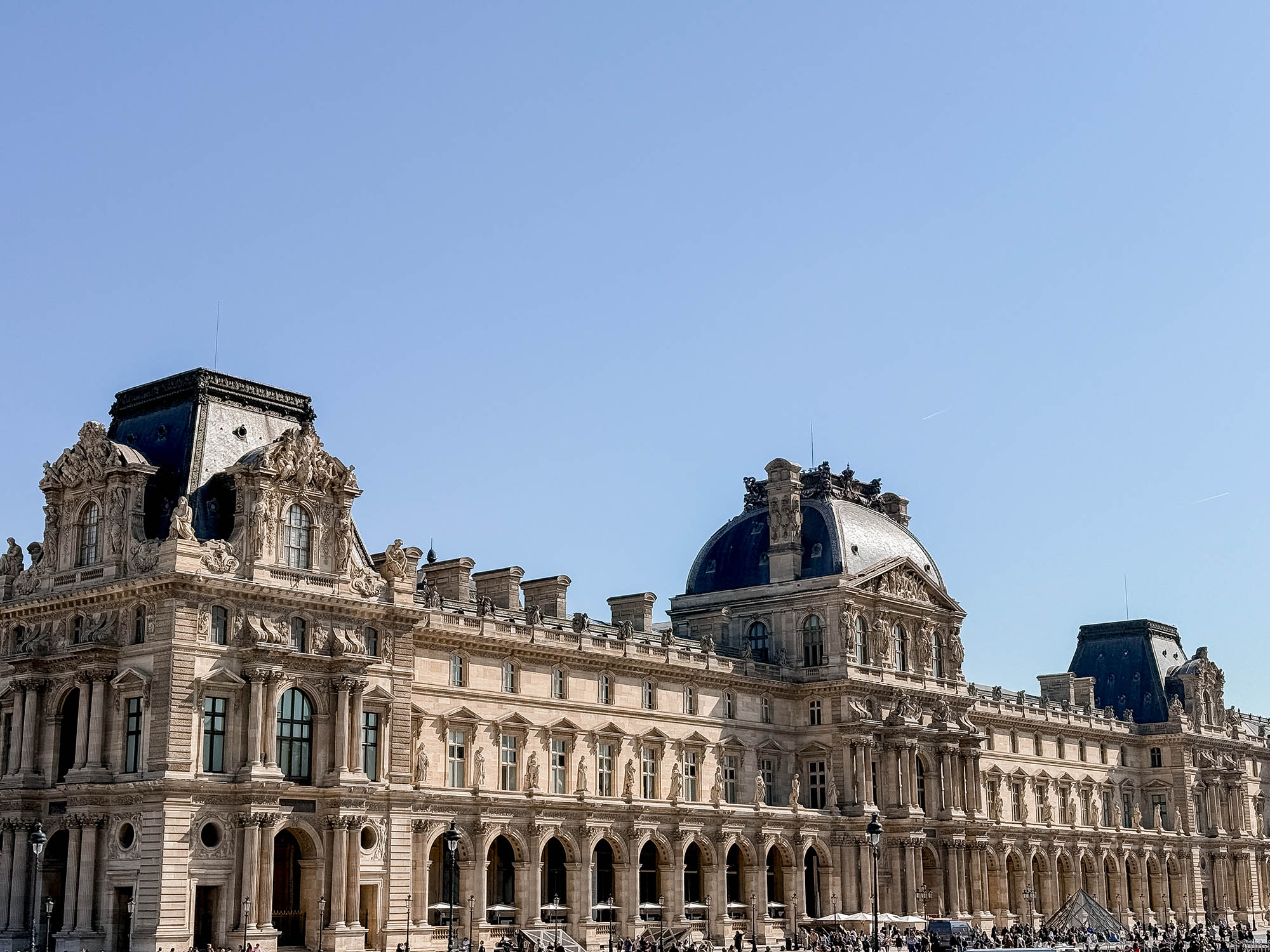 louvre building seen from paris hop on hop off bus tour