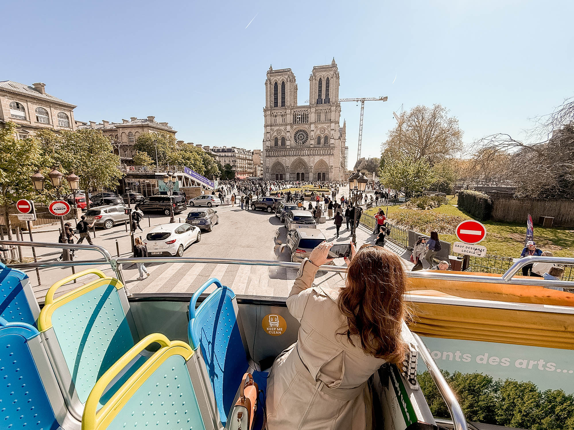 the view of notre dame cathedral from the toot bus hop on hop off paris bus tour