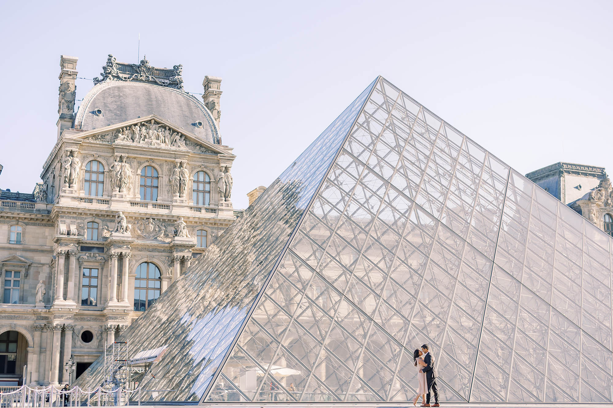 couple's portrait at the louvre pyramid