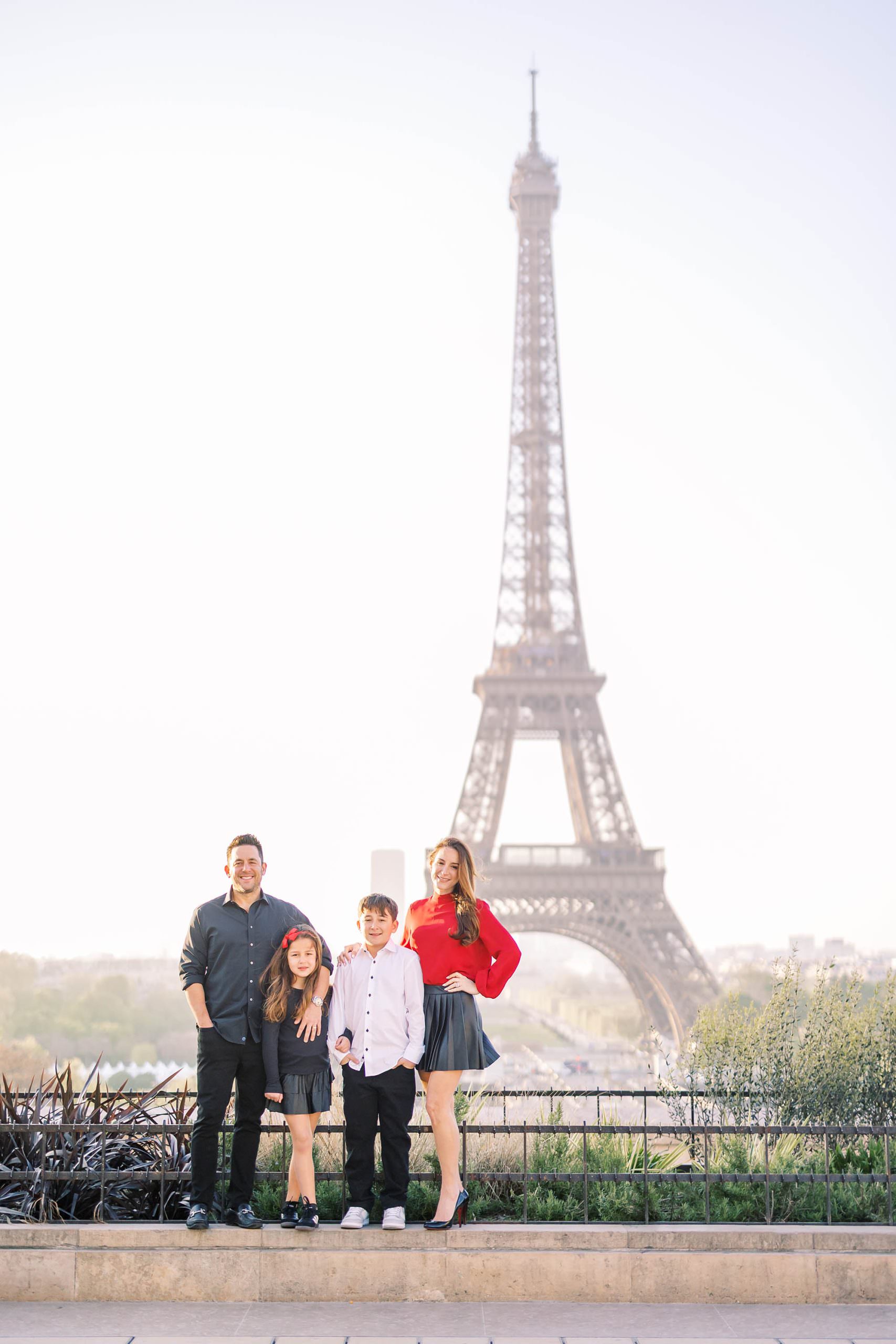 stylish family portrait at the eiffel tower