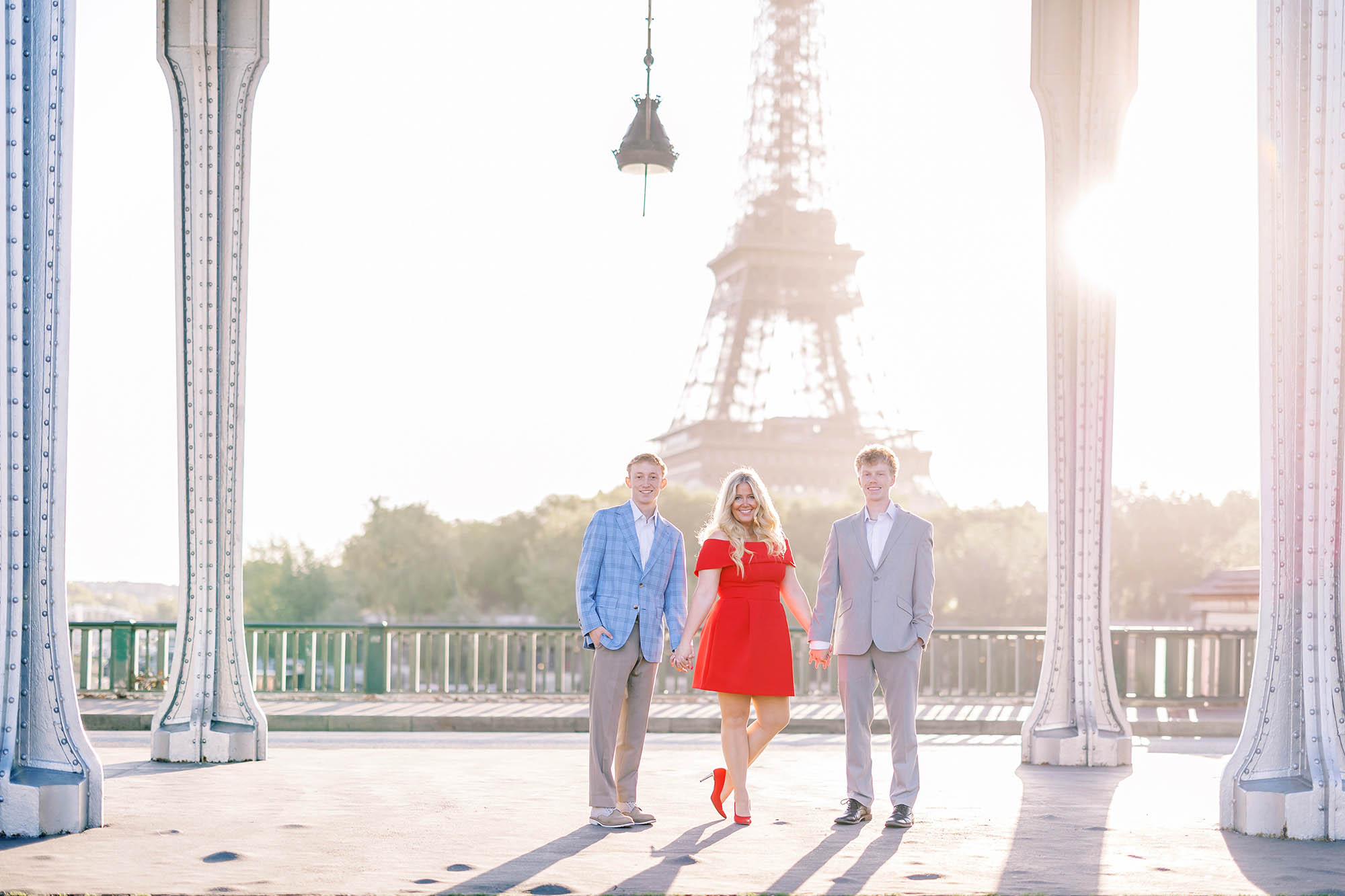 mother and two sons portrait in paris on pont bir hakeim