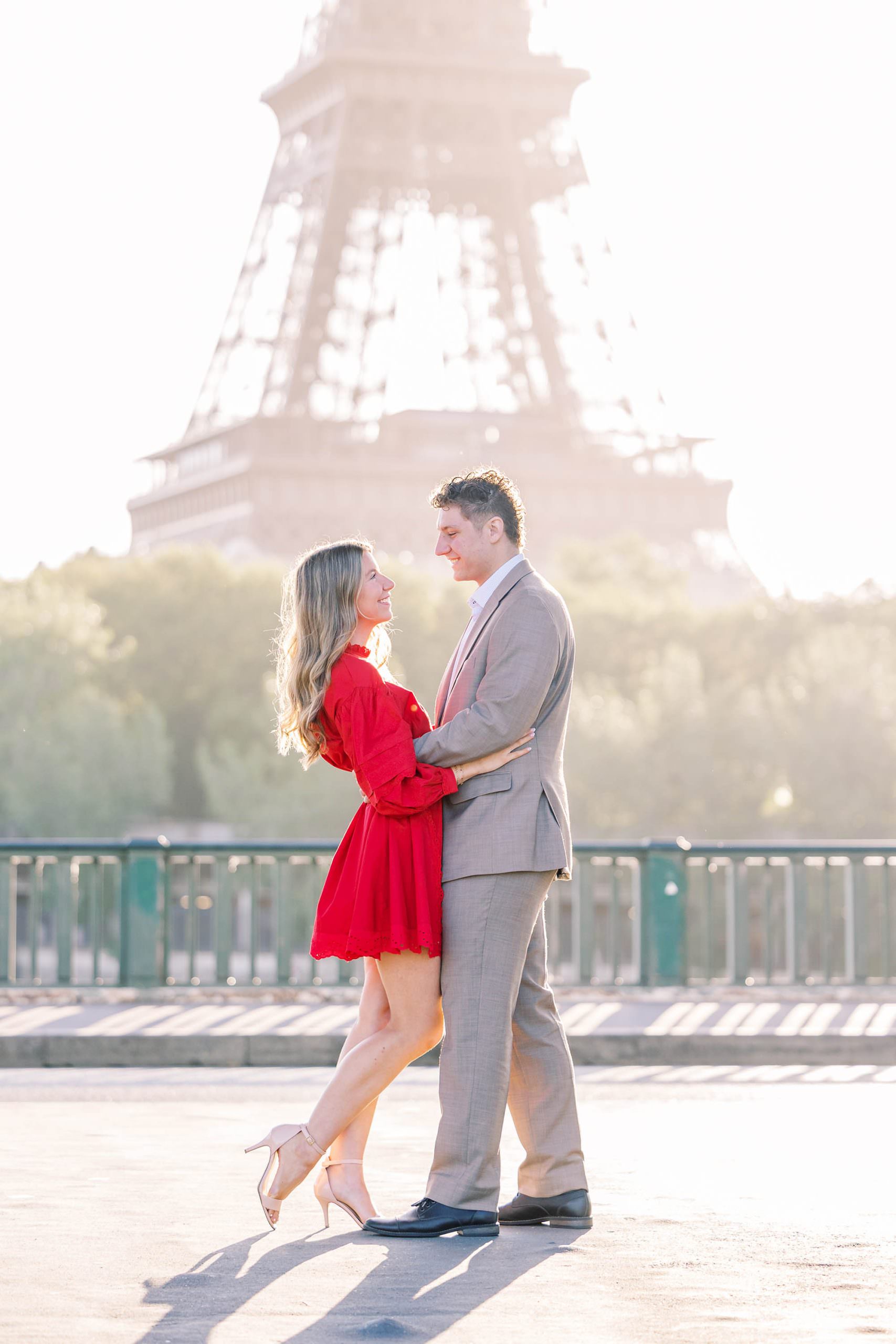 young couple in love in paris having their photo taken by a paris photographer