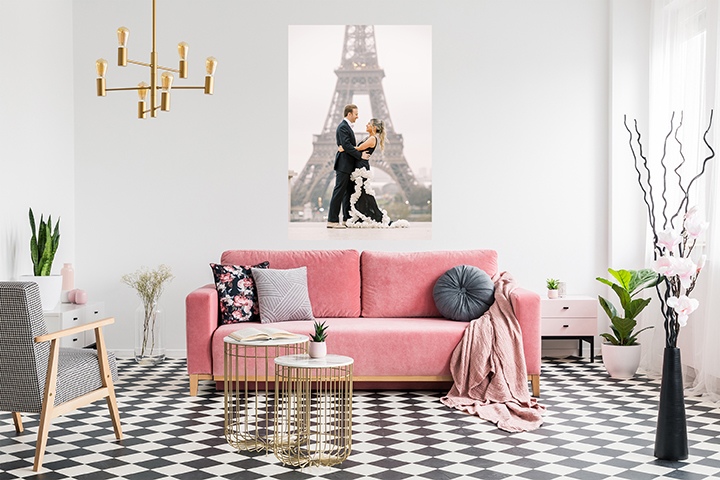 paris couples photoshoot wall art with eiffel tower and pink sofa
