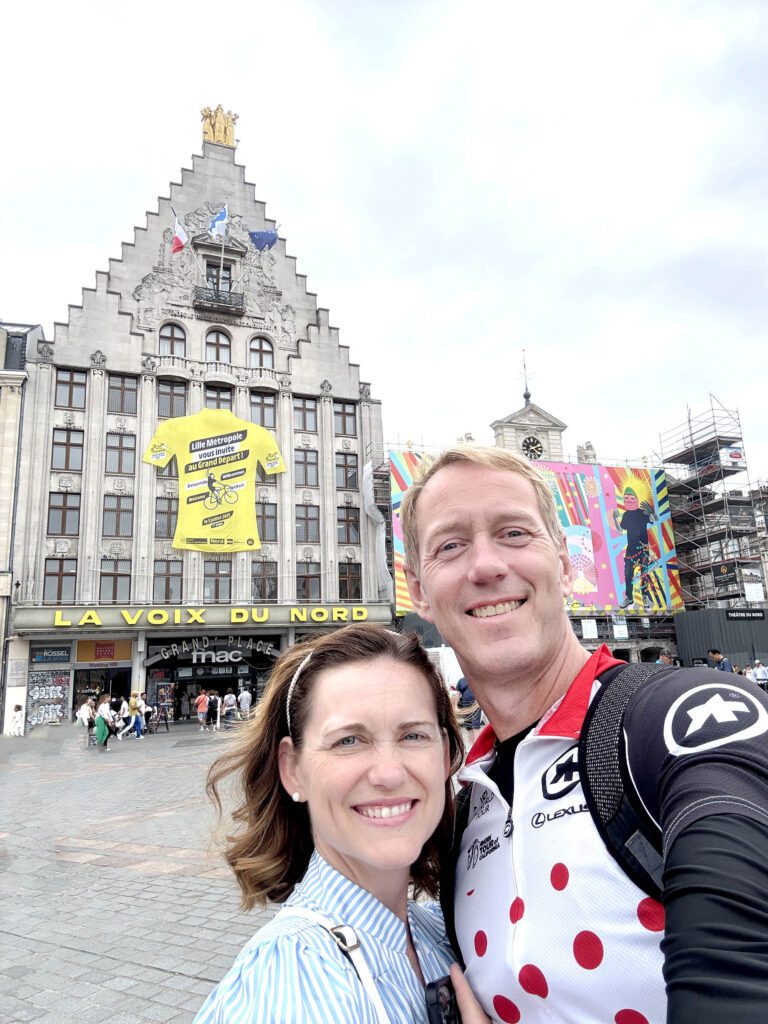 a couple at the opening stage of the 2025 tour de france in lille